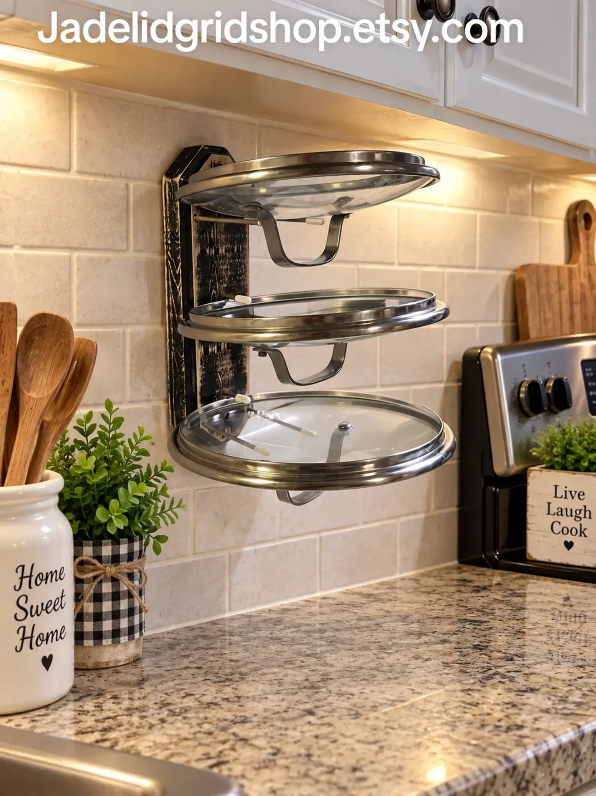 Three tier cooking lid holder that holds cooking lids upside down to prevent spillage of condensation on your counters and also frees up counterspace for meal prep. Very handy to have one on each side of your stove. They hold all shapes and sizes of lids, platters & cookie sheets. They can also be mounted inside cabinets to organize your cooking lids. (Black option shown here)