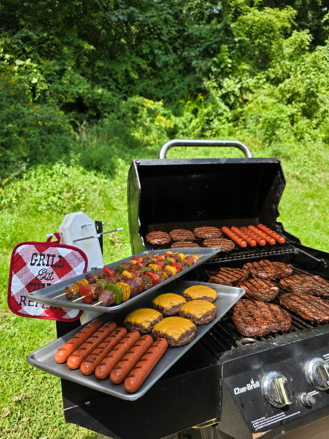 Three-tier handmade wooden cooking lid holder that also hold baking pans, cooling racks, muffin pans and platters. The angle allows it to hold a lot of weight without tipping. You can also hang pot holders and utensils on the side pegs. Also amazing for grilling, camping, or saving space in RVs and picnic tables. (White option shown)